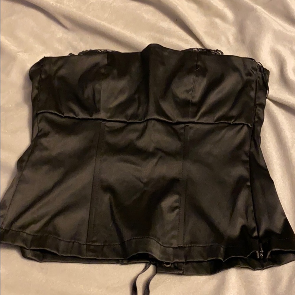 Satin corset with lace detail peaking through